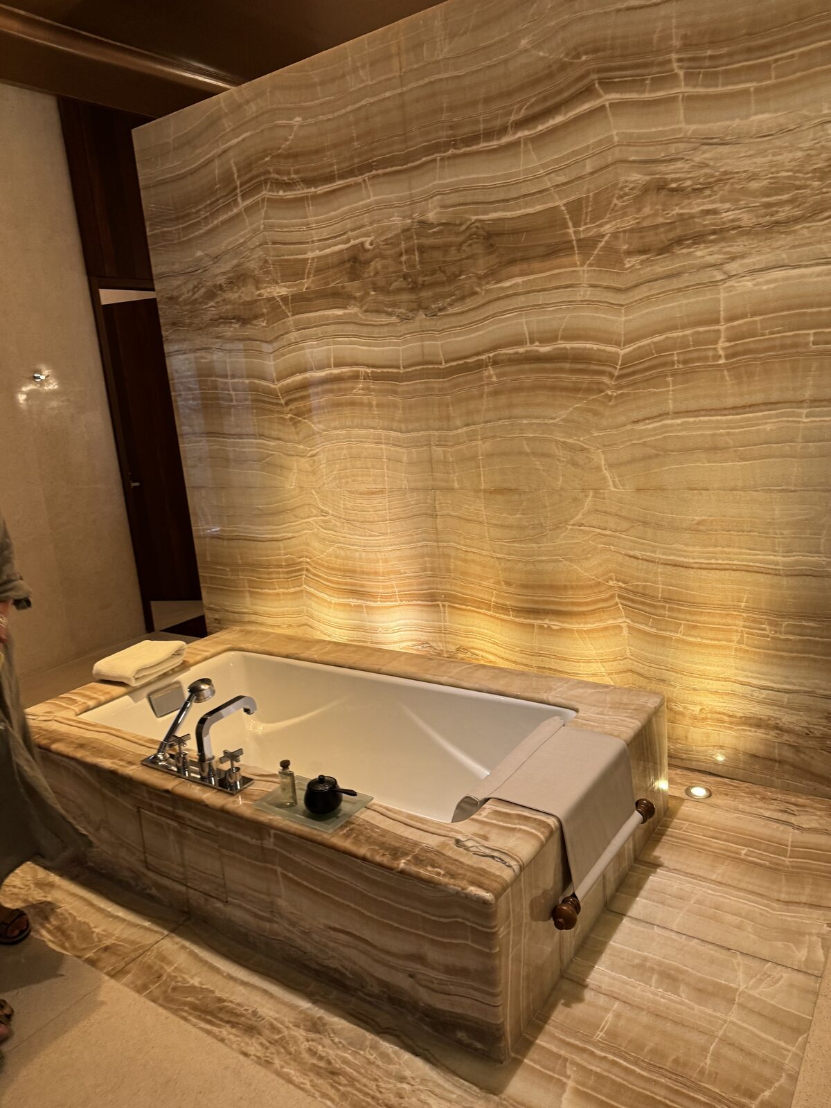 Onyx-lit bathroom inside a private villa