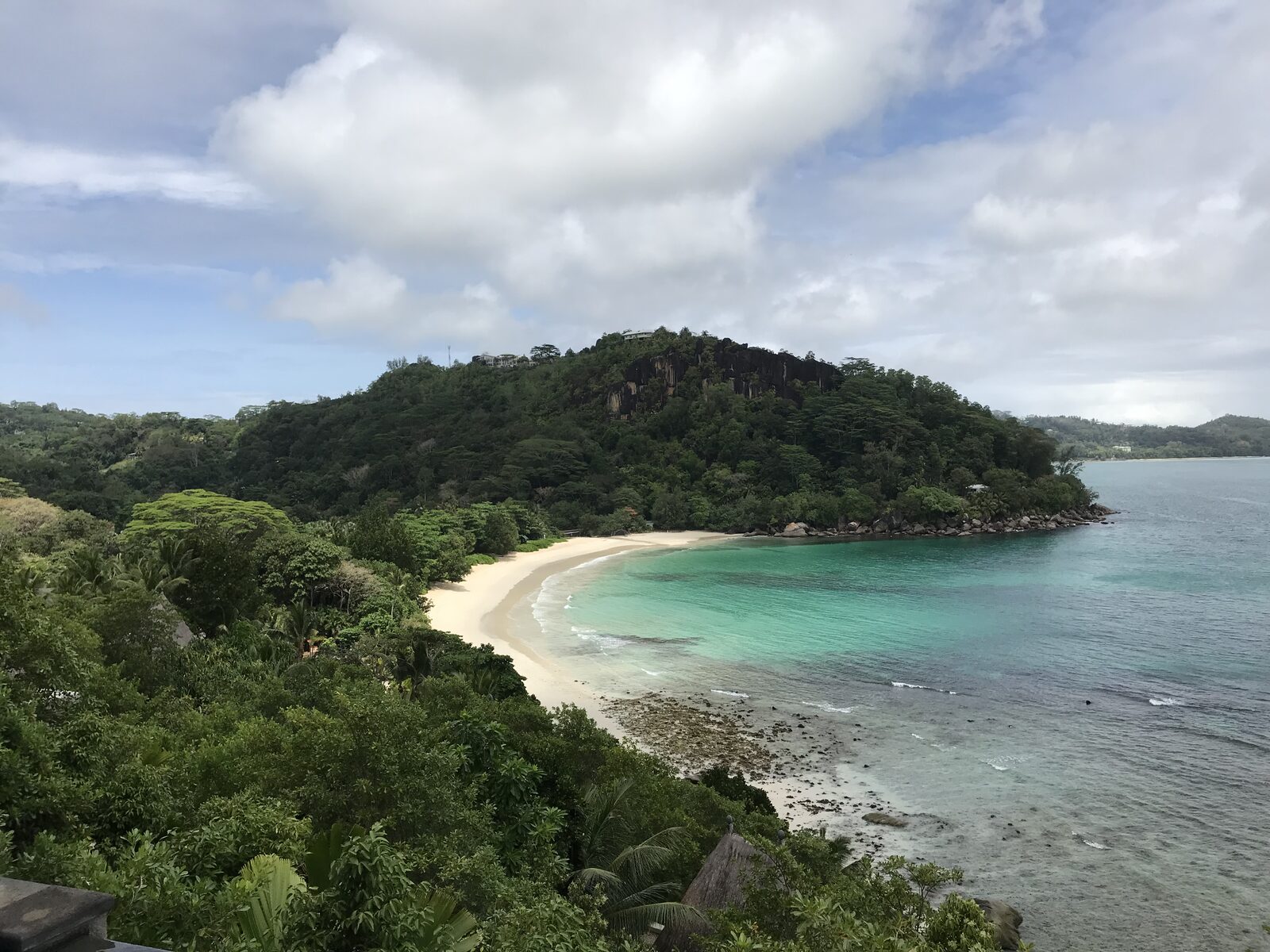 Palm-fringed cove in the Seychelles